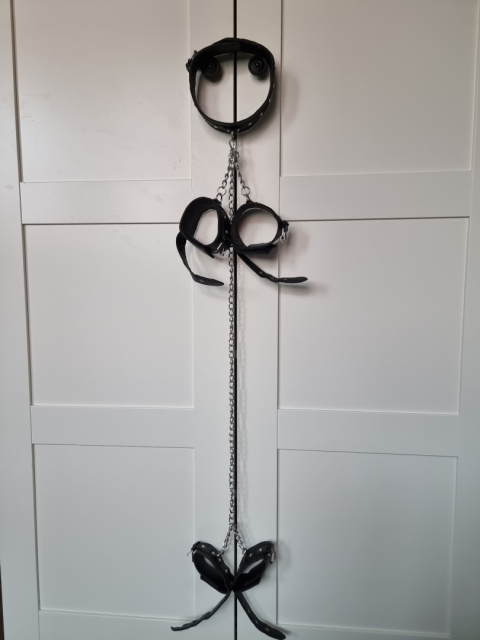 Collar and handcuffs connected with chains