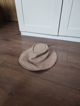 Beige hat made of natural leather of an African animal