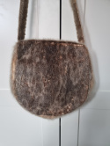 Handmade handbag made of leather and fur in Indian style