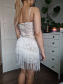 A crazy, feminine dress with fringes and embroidery for New Year's Eve, a party