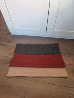 Woolen snood in shades of red, gray, and beige