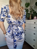 Cute white and blue tied blouse with diamond necklace