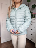 Pistachio quilted jacket with a hood for spring