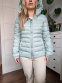 Pistachio quilted jacket with a hood for spring